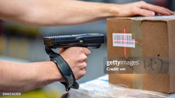 scanning package with bar code reader - postal bar code stock pictures, royalty-free photos & images