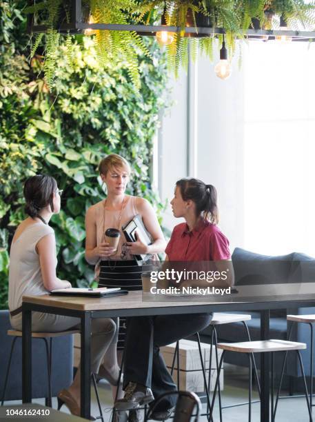 meeting in the office common area - business man in crowd stock pictures, royalty-free photos & images