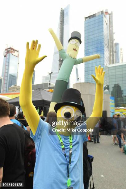 Cosplayer poses next to the Rickmobile during New York Comic Con 2018 at Jacob Javits Center on October 5, 2018 in New York City. 423701