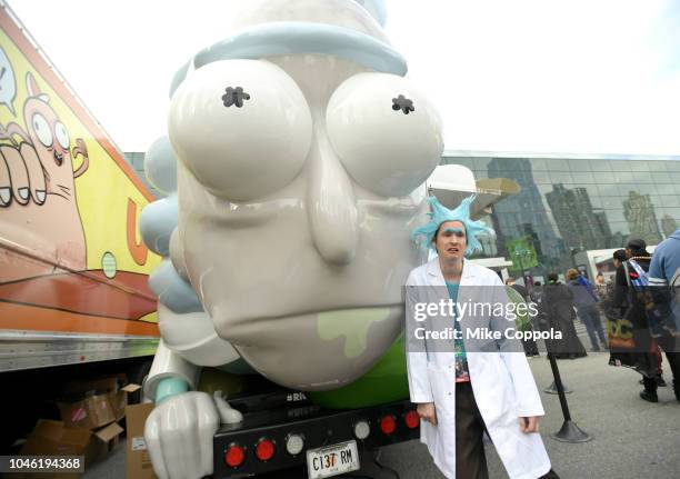 Cosplayer poses next to the Rickmobile during New York Comic Con 2018 at Jacob Javits Center on October 5, 2018 in New York City. 423701