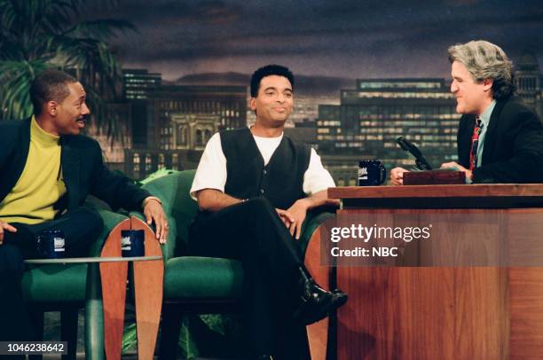 Episode 464 -- Pictured: Actor Eddie Murphy and singer-songwriter Jon Secada during an interview with host Jay Leno on May 23rd, 1994 --