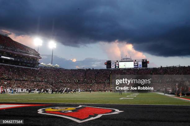 General view as a storm moves in above the stadium during the first half of the game between the Louisville Cardinals and Georgia Tech Yellow Jackets...