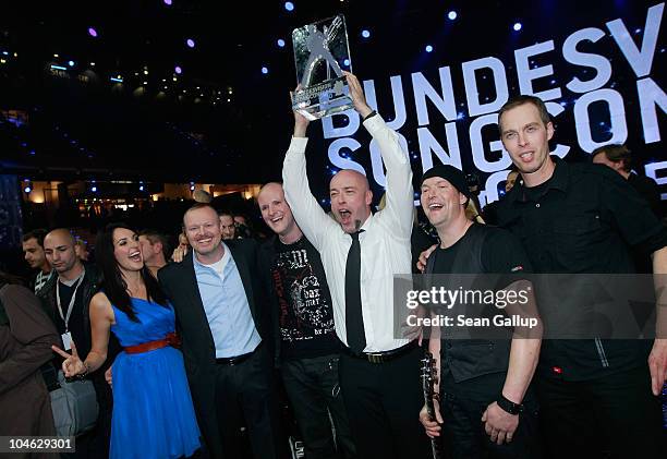 Der Graf of the band Unheilig from North Rhine-Westphalia poses with contest hosts Stefan Raab , Johanna Klum and band members after winning first...