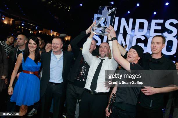 Der Graf of the band Unheilig from North Rhine-Westphalia poses with contest hosts Stefan Raab , Johanna Klum and band members after winning first...