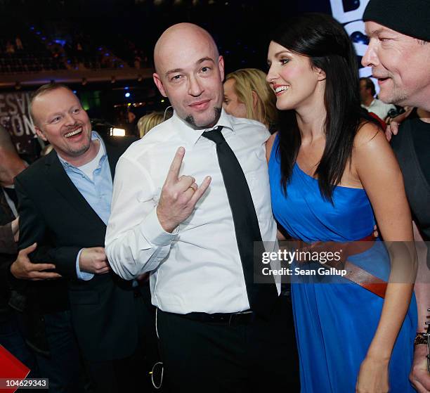 Der Graf of the band Unheilig from North Rhine-Westphalia poses with contest hosts Stefan Raab and Johanna Klum after winning first place at the 2010...