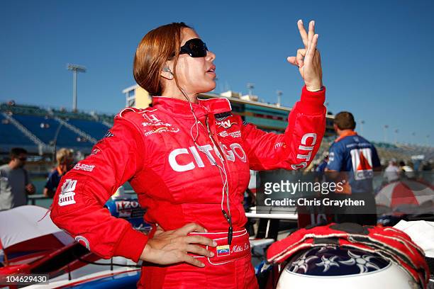 Milka Duno of Venezuela, driver of the CITGO Dallara Honda stands on pit road during qualifying for the IZOD IndyCar Series Cafes do Brasil Indy 300...