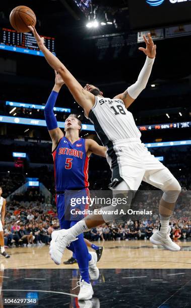 Marco Belinelli of the San Antonio Spurs loses control of the ball after being fouled by Luke Kennard of the Detroit Pistons during a preseason game...