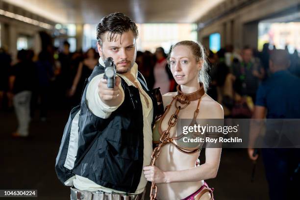 Fans cosplay as Han Solo and Princess Leia form Star Wars during the 2018 New York Comic Con at Javits Center on October 5, 2018 in New York City.