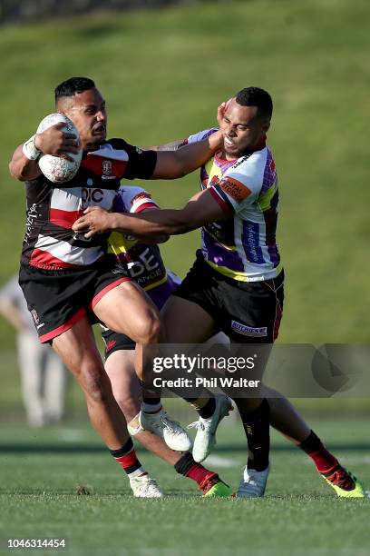 Toni Pulu of Counties is tackled by Tevita Li of North Harbour during the round eight Mitre 10 Cup match between North Harbour and Counties Manakau...