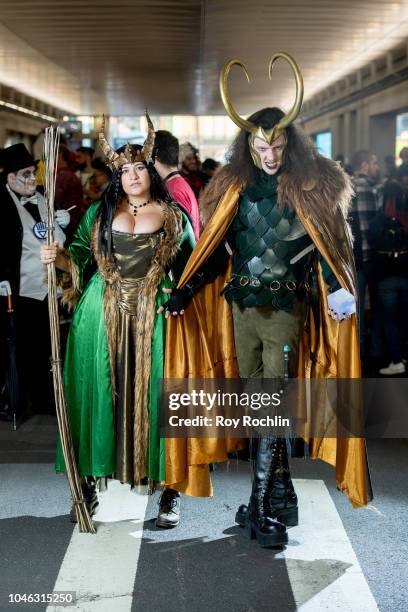 Fan cosplays as Lady Loki and Loki form the Marvel Universe during the 2018 New York Comic Con at Javits Center on October 5, 2018 in New York City.