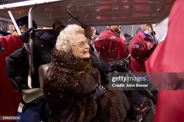 Playoffs: Chicago Bears owner Virginia Halas McCaskey victorious with son Michael McCaskey in golf cart after winning game vs New Orleans Saints....