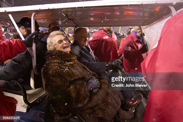 Playoffs: Chicago Bears owner Virginia Halas McCaskey victorious with son Michael McCaskey in golf cart after winning game vs New Orleans Saints....