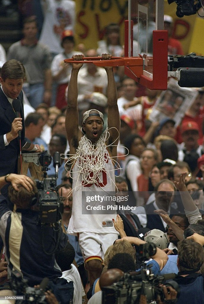 1995 Rockets Final Houston Rockets Kenny Smith victorious, hanging from rim and cutting ...