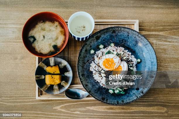 flat lay of delicate japanese meal with appetizer, miso soup and tea freshly served on table in a restaurant - japanese food 個照片及圖片檔