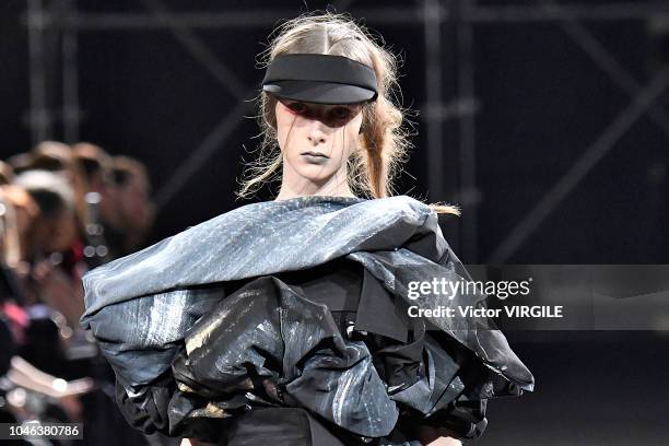 Model walks the runway during the Yohji Yamamoto Ready to Wear fashion show as part of the Paris Fashion Week Womenswear Spring/Summer 2019 on...