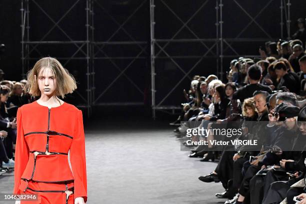 Model walks the runway during the Yohji Yamamoto Ready to Wear fashion show as part of the Paris Fashion Week Womenswear Spring/Summer 2019 on...