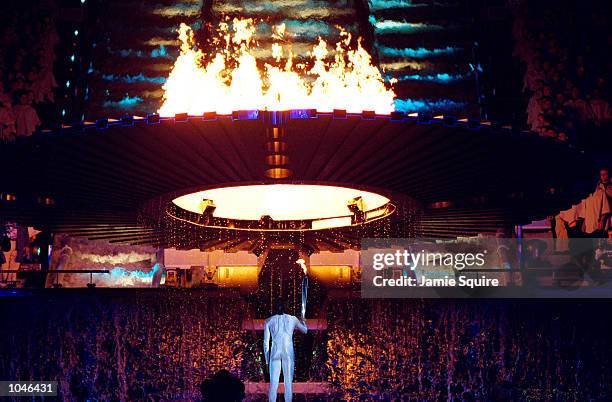 Cathy Freeman of Australia lights the Olympic cauldron during the Opening Ceremony of the Sydney 2000 Olympic Games at the Olympic Stadium in...