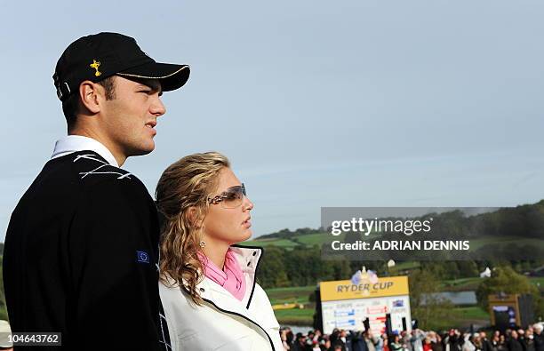 Europe Ryder Cup team player Martin Kaymer stands with his partner Allison Micheletti during the opening fourball round on the second day of the 2010...