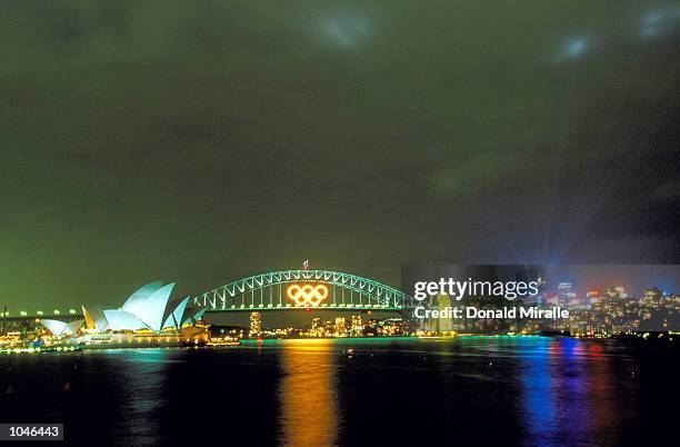 General view of the Opera House and the Olympic Rings illuminated on the Harbour Bridge before the Sydney 2000 Olympic Games at the Olympic Stadium...