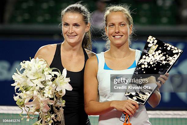 Iveta Benesova and Barbora Zahlavova Strycova of the Czech Republic pose with a trophy during the award ceremony after winning the Women's Doubles...