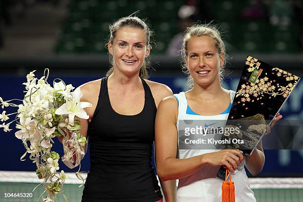 Iveta Benesova and Barbora Zahlavova Strycova of the Czech Republic pose with a trophy during the award ceremony after winning the Women's Doubles...