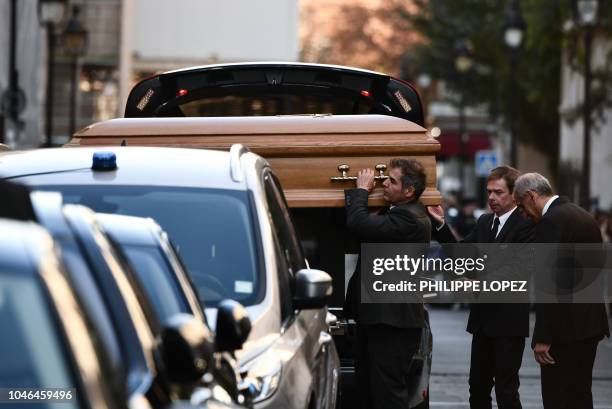 Pallbearers carry the coffin of French-Armenian singer-songwriter Charles Aznavour into the Saint-Jean-Baptiste de Paris Armenian Cathedral at the...