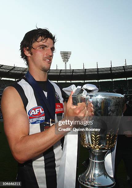 Scott Pendlebury of the Magpies celebrates with the Premiership Cup after the Magpies won the AFL Grand Final Replay match between the Collingwood...