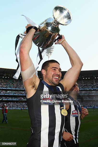 Chris Dawes of the Magpies celebrates with the Premiership Cup after the Magpies won the AFL Grand Final Replay match between the Collingwood Magpies...