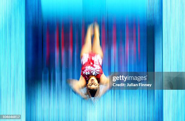 Competitor makes a practice dive from the 5 metre board during a training session at the Dr. S.P. Mukherjee Aquatics Complex ahead of the Delhi 2010...