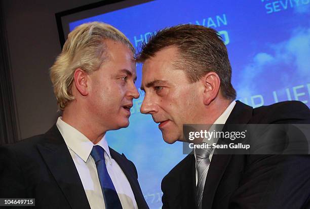 German renegade former Christian Democrat Rene Stadtkewitz and Dutch right-wing politician Geert Wilders talk after Wilders spoke on October 2, 2010...
