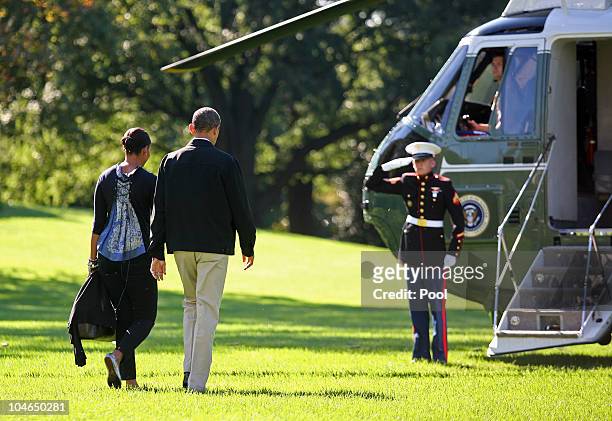President Barack Obama and first lady Michelle Obama waslk towards Marine One as they depart from the South Lawn of the White House October 2, 2010...