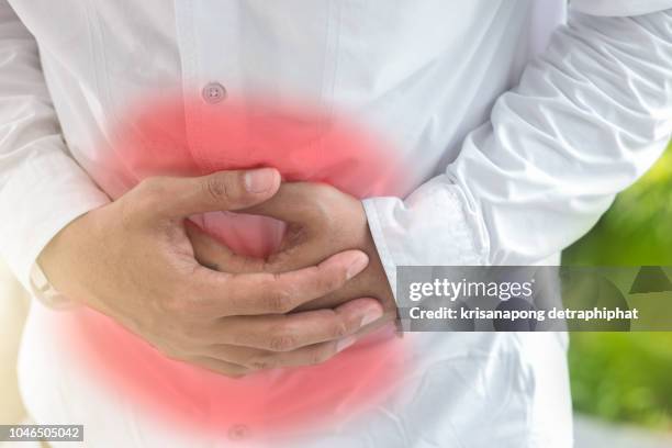 businessman stomachache - inflammation stock pictures, royalty-free photos & images