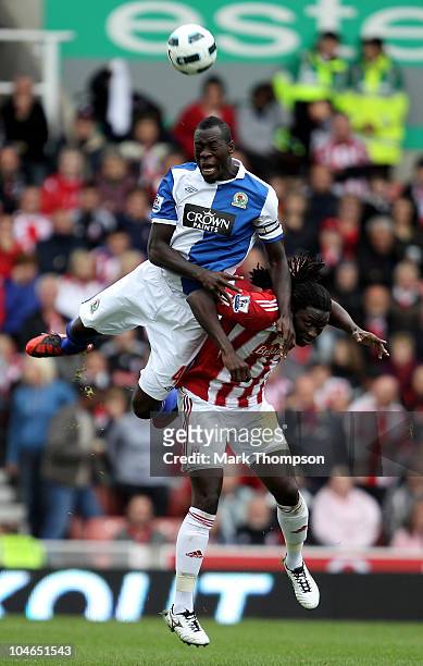 Kenwyne Jones of Stoke City battles for the ball with Christopher Samba of Blackburn Rovers during the Barclays Premier League match between Stoke...