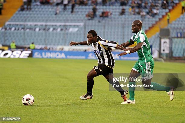 Kwadwo Asamoah of Udinese competes with Stephen Appiah of Cesena during the Serie A match between Udinese Calcio and AC Cesena at Stadio Friuli on...