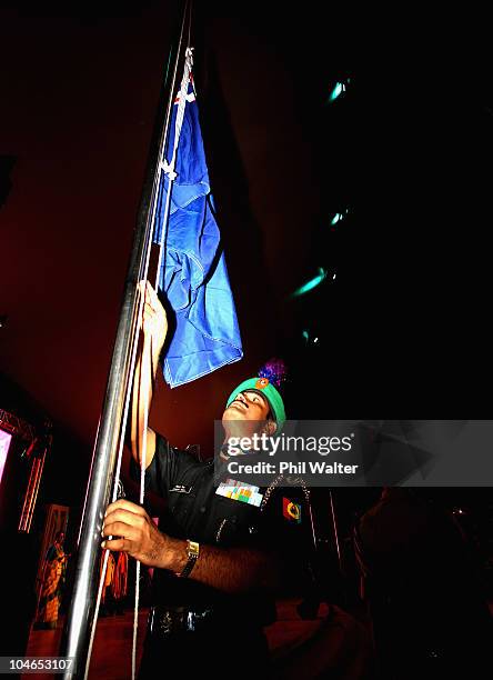 The New Zealand flag is raised during the New Zealand team welcoming ceremony in the International Zone of the Athletes Village ahead of the Delhi...