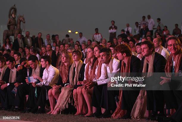 The New Zealand team watch the festivities during their welcoming ceremony in the International Zone of the Athletes Village ahead of the Delhi 2010...