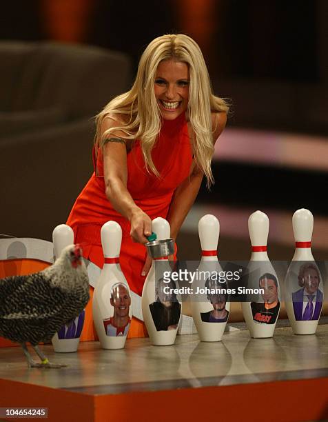 Host Michelle Hunziker and chicken Clara attends the 190th 'Wetten, dass ...?' show at Olympiahalle on October 2, 2010 in Munich, Germany.