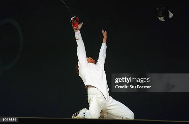 Pavel Kolobkov of Russia celebrates winning the Gold Medal by defeating Hugues Obry of France during the Mens Individual Epee Fencing Final at the...