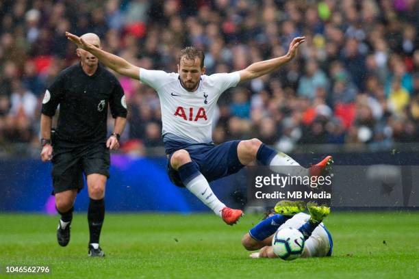 Harry Kane of Tottenham Hotspur is tackled by Harry Arter of Cardiff City during the Premier League match between Tottenham Hotspur and Cardiff City...