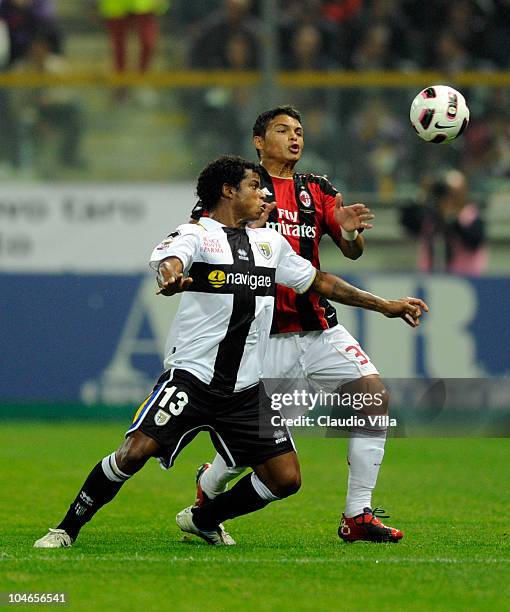 Thiago Silva of AC Milan and Angelo of Parma FC compete for the ball during the Serie A match between Parma FC and AC Milan at Stadio Ennio Tardini...