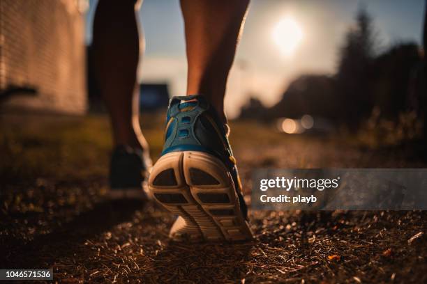 close up shot of runner's shoes - taking a shot - sport imagens e fotografias de stock