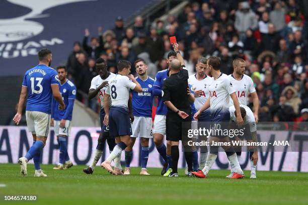Joe Ralls of Cardiff City is shown a red card by match referee Mike Dean during the Premier League match between Tottenham Hotspur and Cardiff City...