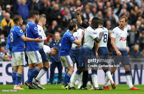Joe Ralls of Cardiff City receives a red card from match referee Mike Dean during the Premier League match between Tottenham Hotspur and Cardiff City...