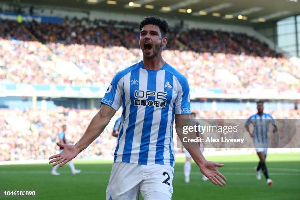 Christopher Schindler of Huddersfield Town celebrates after scoring his team's first goal during the Premier League match between Burnley FC and...