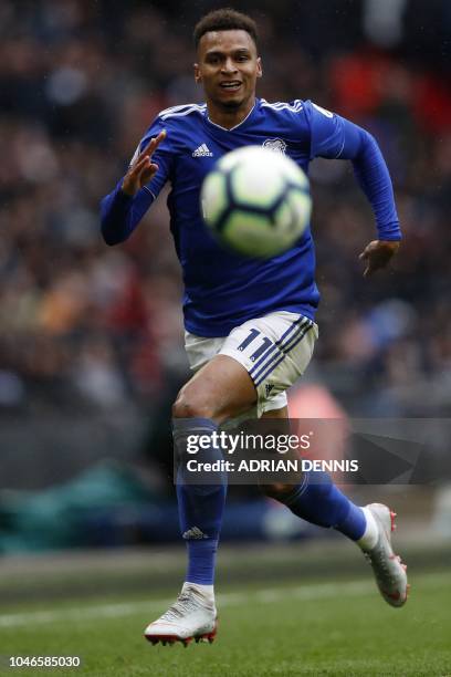 Cardiff City's English midfielder Josh Murphy controls the ball during the English Premier League football match between Tottenham Hotspur and...