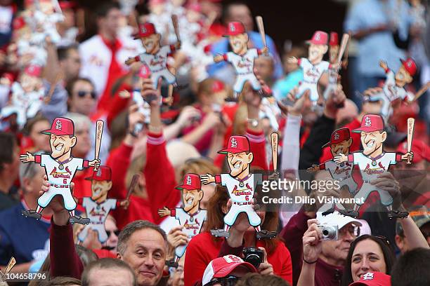 Fans show their support for former St. Louis Cardinals player Stan Musial in between innings as the St. Louis Cardinals play against the Colorado...