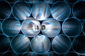 Large Silver Pipes Stacked At Factory