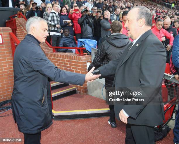 Manager Jose Mourinho of Manchester United greets Manager Rafael Benitez of Newcastle United ahead of the Premier League match between Manchester...