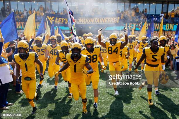 West Virginia Mountaineers take the field before the game against the Kansas Jayhawks at Mountaineer Field on October 6, 2018 in Morgantown, West...