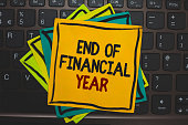 Word writing text End Of Financial Year. Business concept for Revise and edit accounting sheets from previous year Multiple colour sticky border cards computer keyboard text send message.